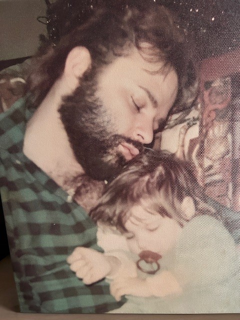 Lou Christie asleep with his baby daughter